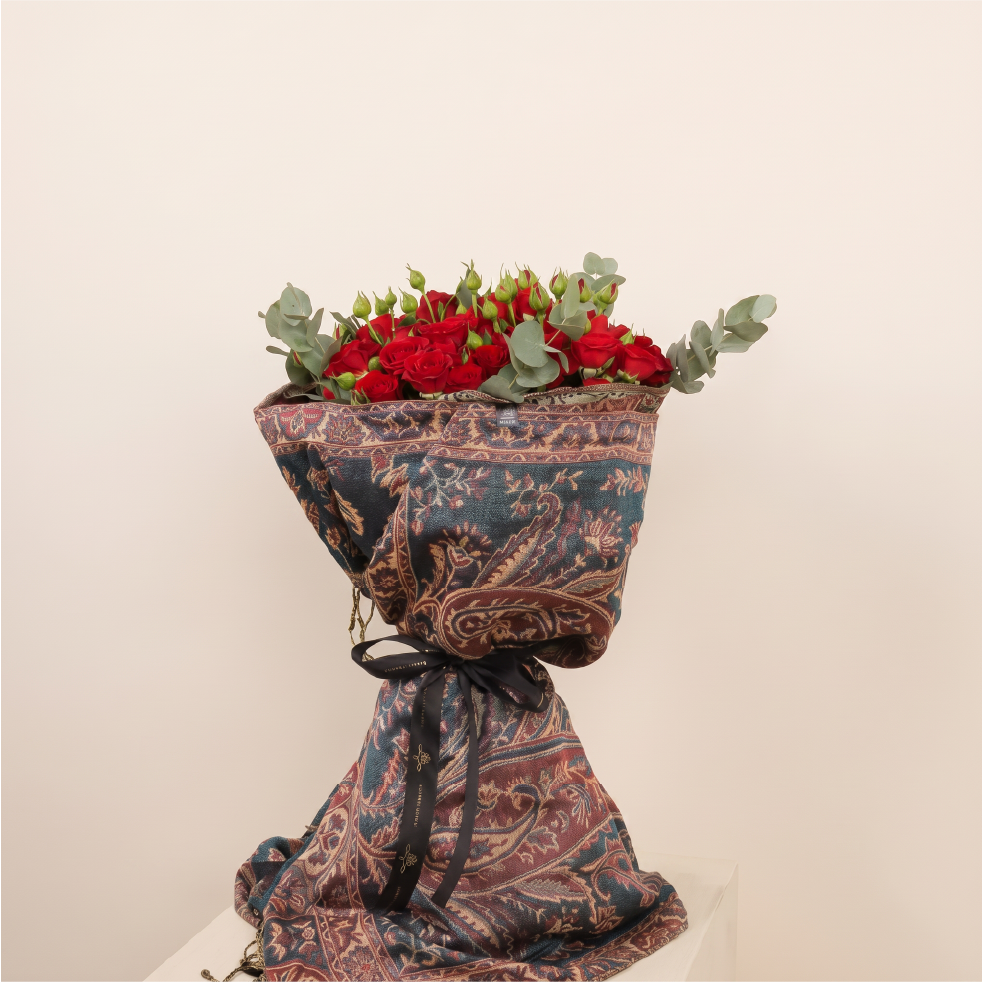 bouquet wrapped in cashmere scarf