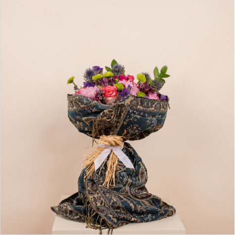 bouquet wrapped in a luxurious cashmere scarf